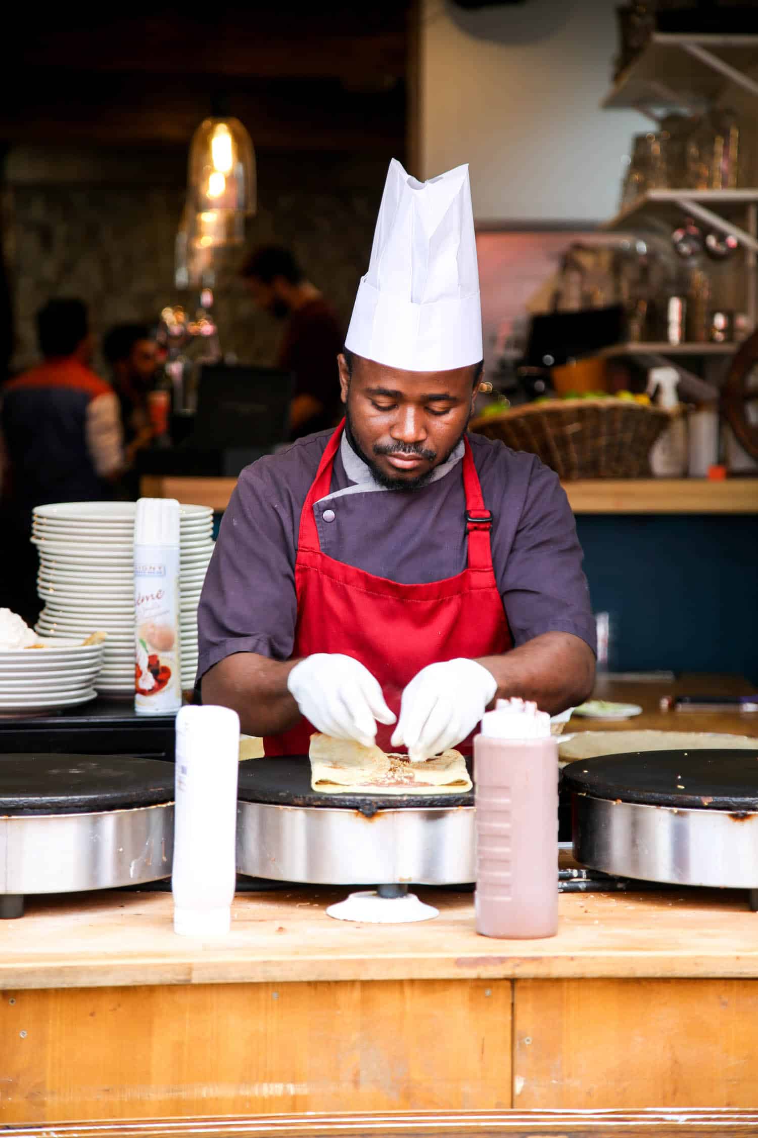 Man making crepes at a restaurant in Paris