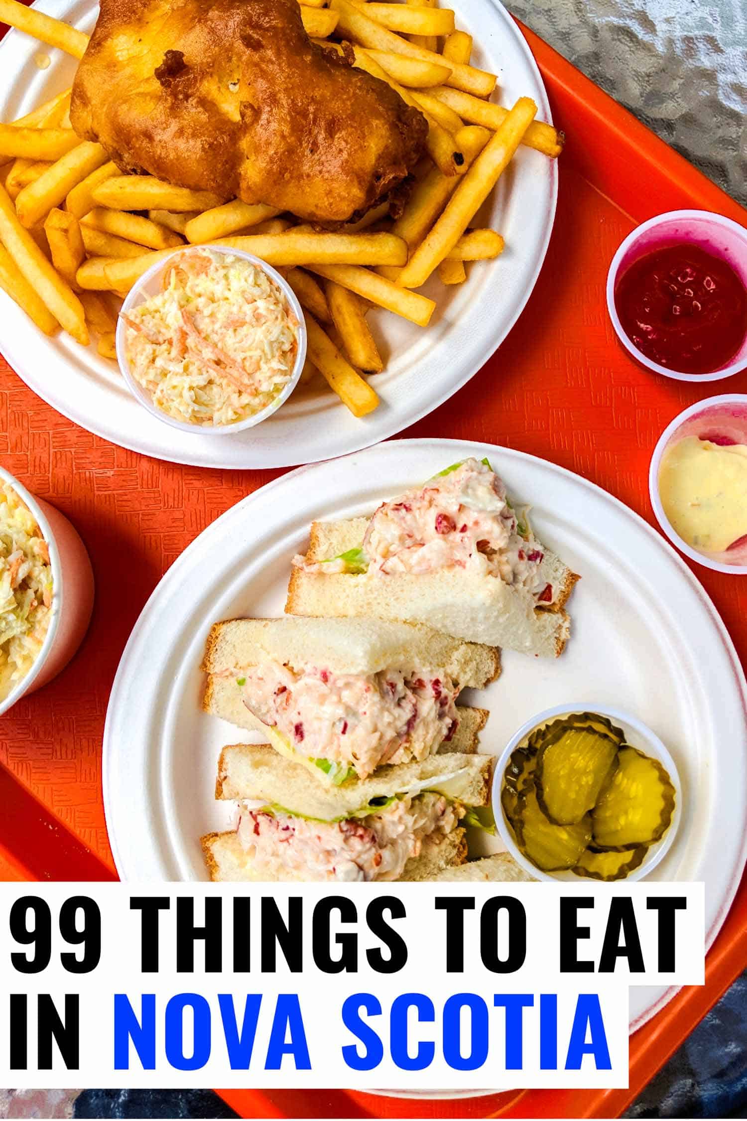 Lobster sandwich and fish and chips on red tray in Nova Scotia.