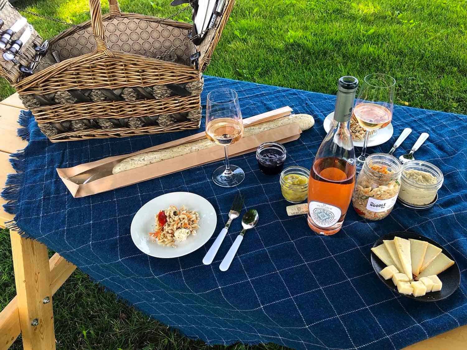 Picnic table with Mercator Vineyards wine and cheese