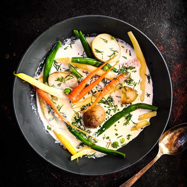 A bowl of vegetables in cream, a traditional recipe in Nova Scotia called hodge podge.