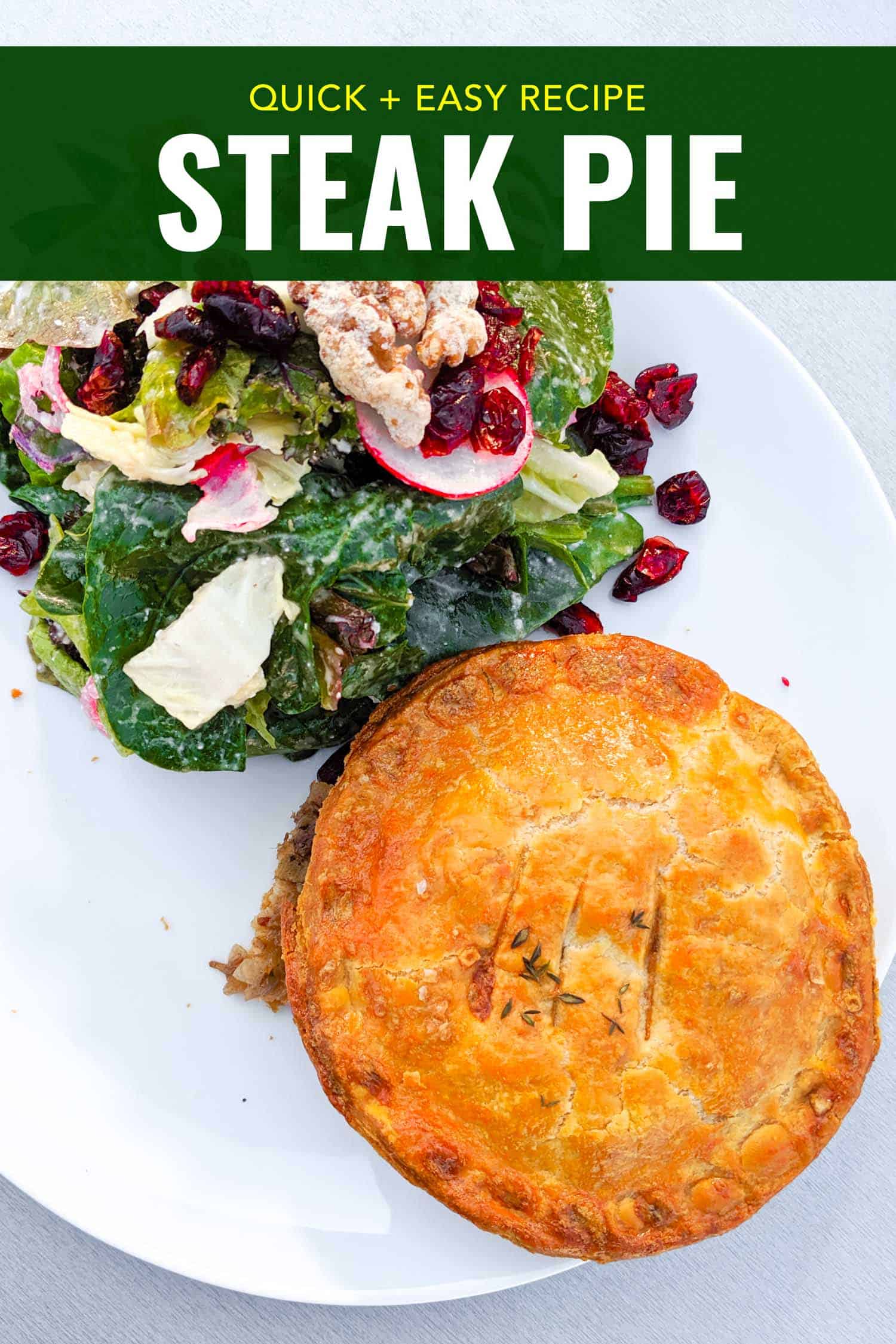 Steak and mushroom pie recipe on a plate with a green salad.