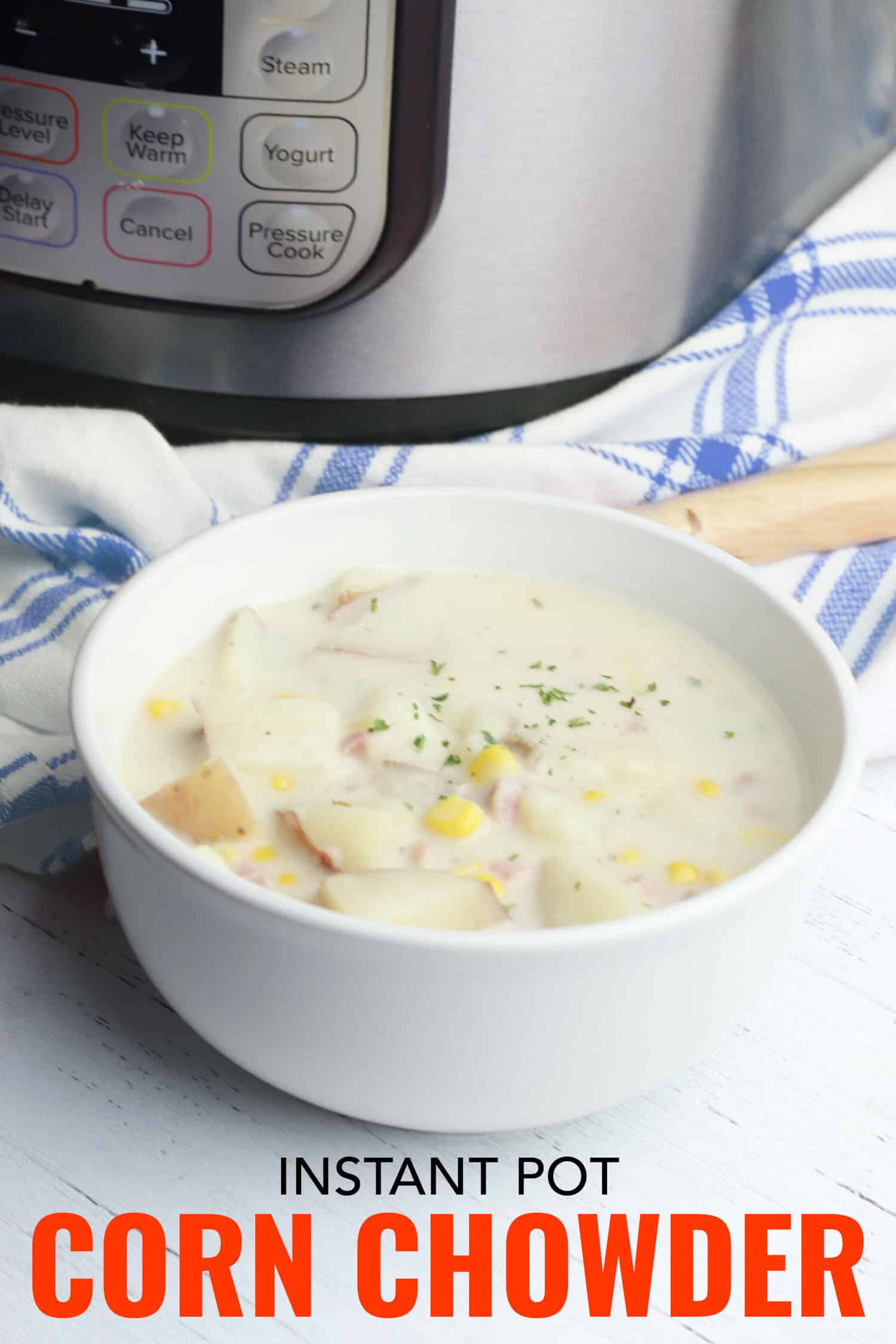 Corn and ham chowder in a bowl beside an instant pot