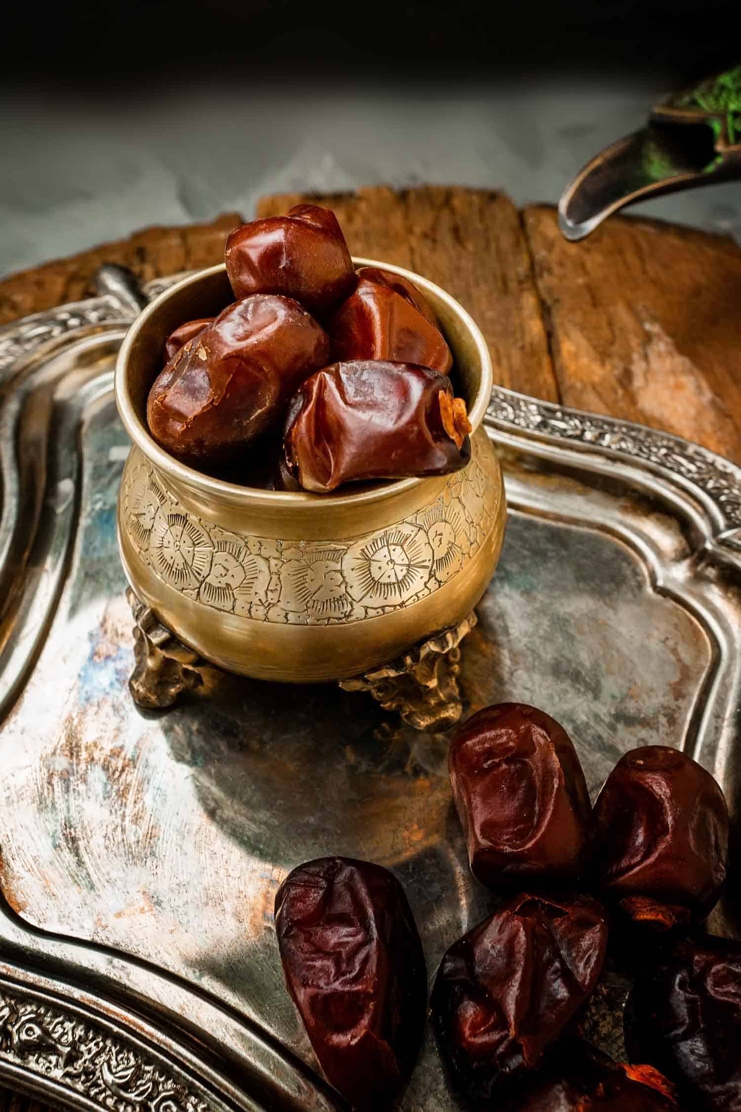 Dried date palm fruits or kurma, ramadan food. Beautiful bowl full of date fruits symbolizing Ramadan. Close -up