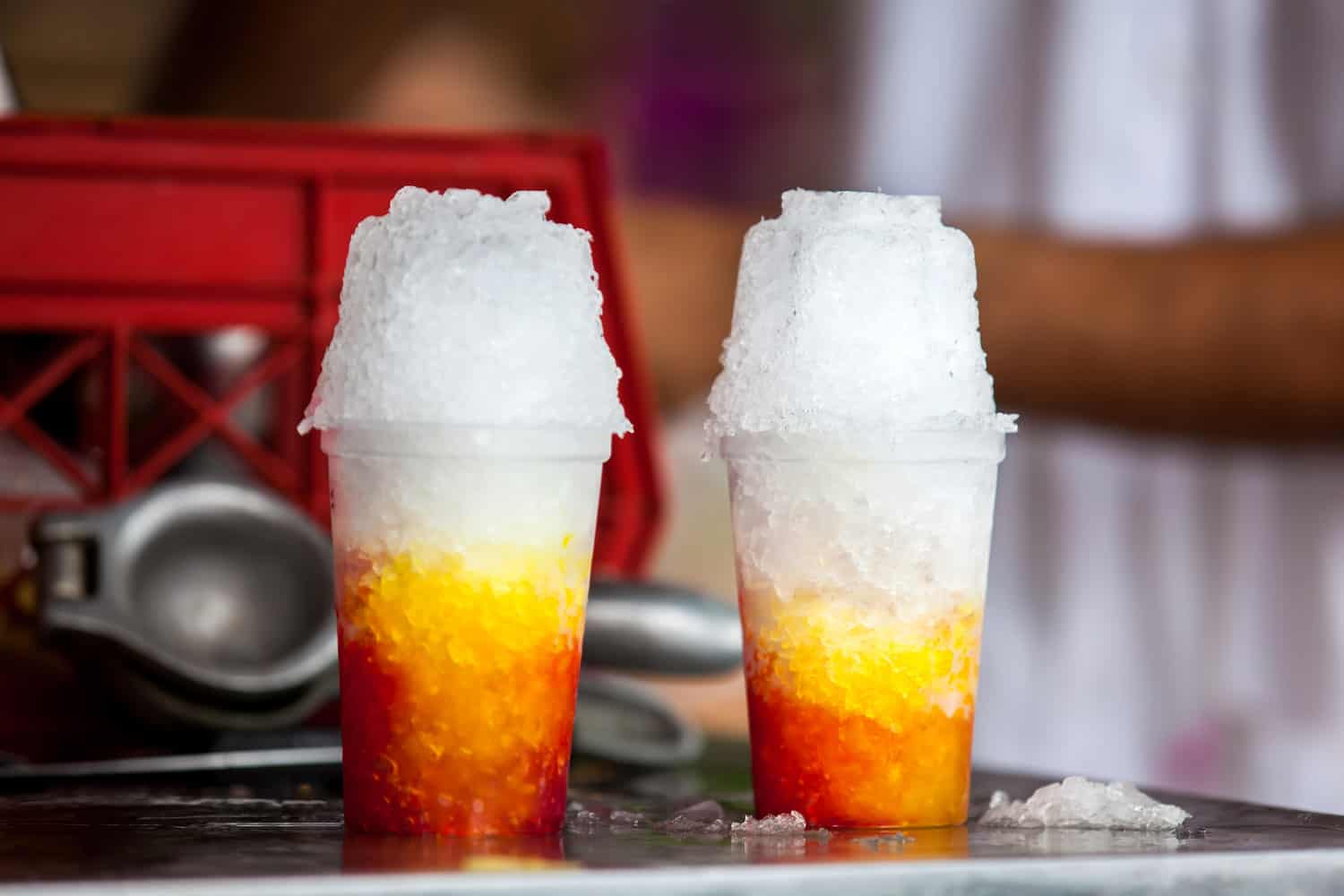 Street vendor in the city of Cali in Colombia preparing and selling a traditional sweet water ice called cholado