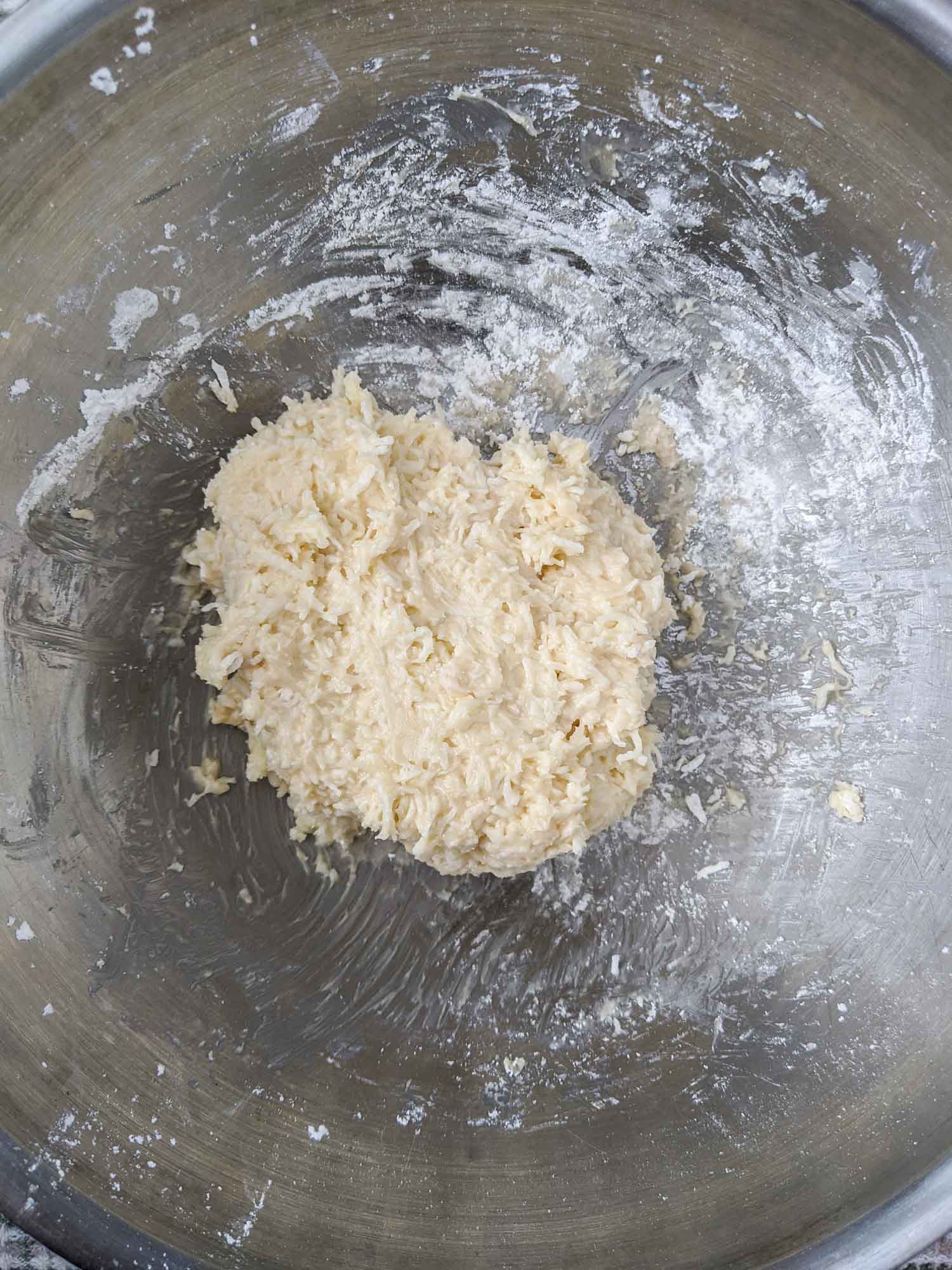Coconut cherry balls in process shot, mixing dough