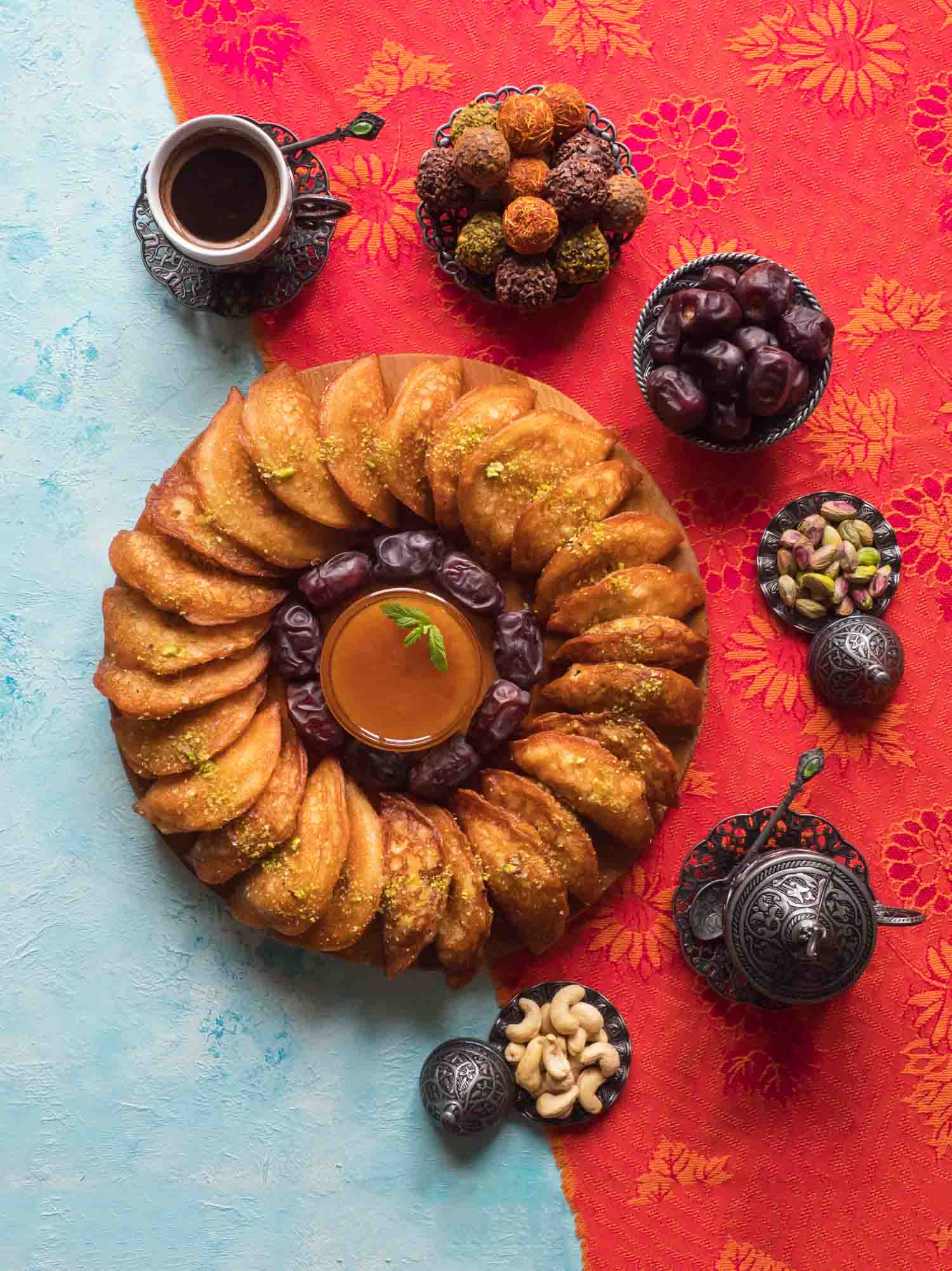 Arabic sweets. Arabian Qatayef, Ghorayeba sweets and Egyptian cookies "Kahk El Eid". Cookies of El Fitr Islamic Feast. Ramadan food background.