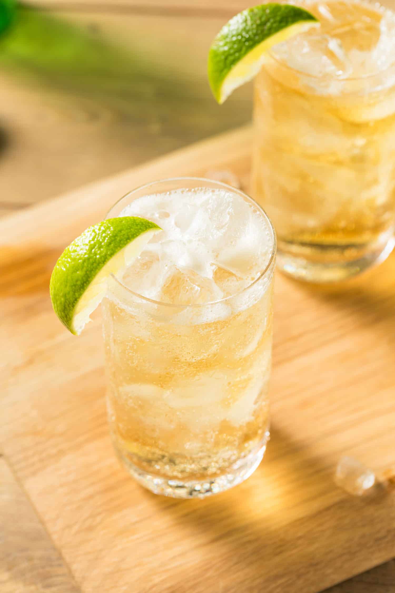 Peruvian Chilcano cocktail served in a glass over ice and garnished with a lime.