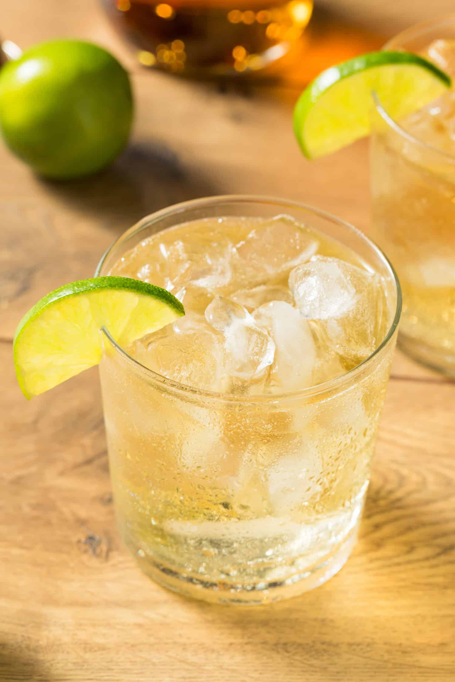 Peruvian Chilcano cocktail served in a glass over ice and garnished with a lime.