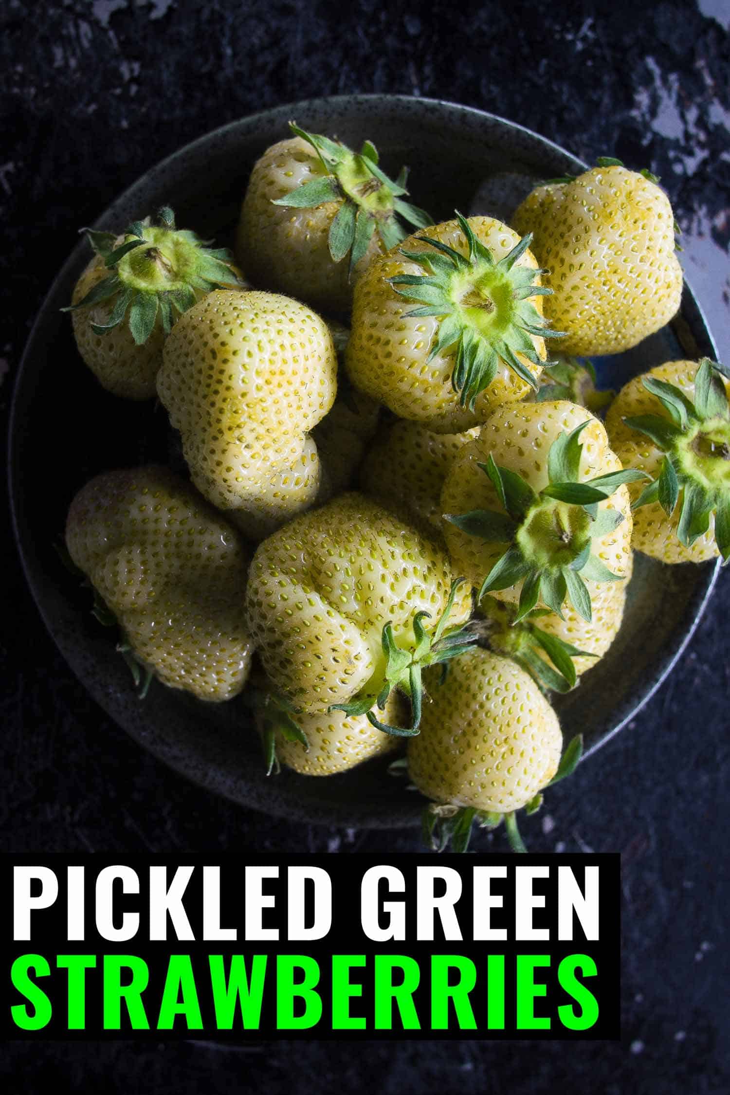 Green strawberries pickled in a bowl