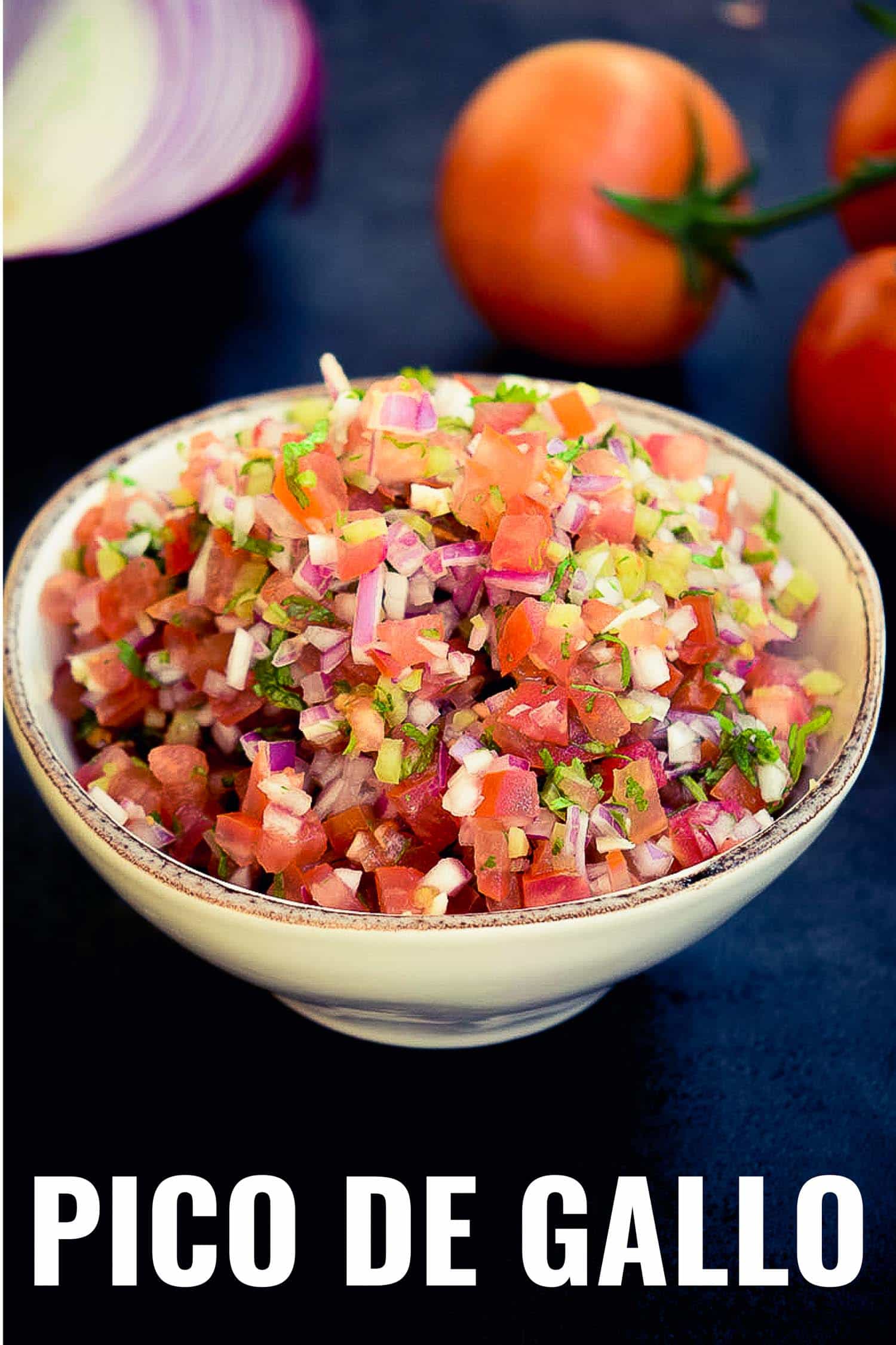 Mexican tomato salsa in a rustic bowl on a blue background