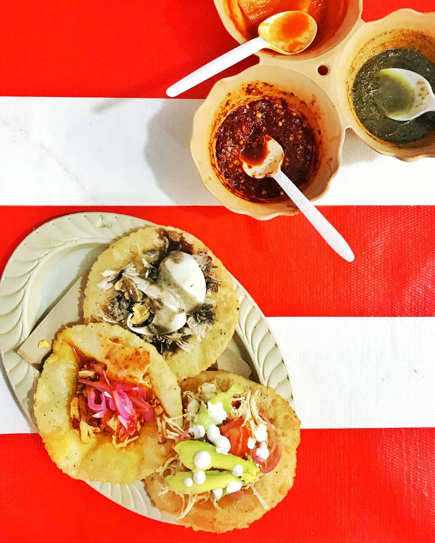 Street food in Belize on a table with red and white stripes