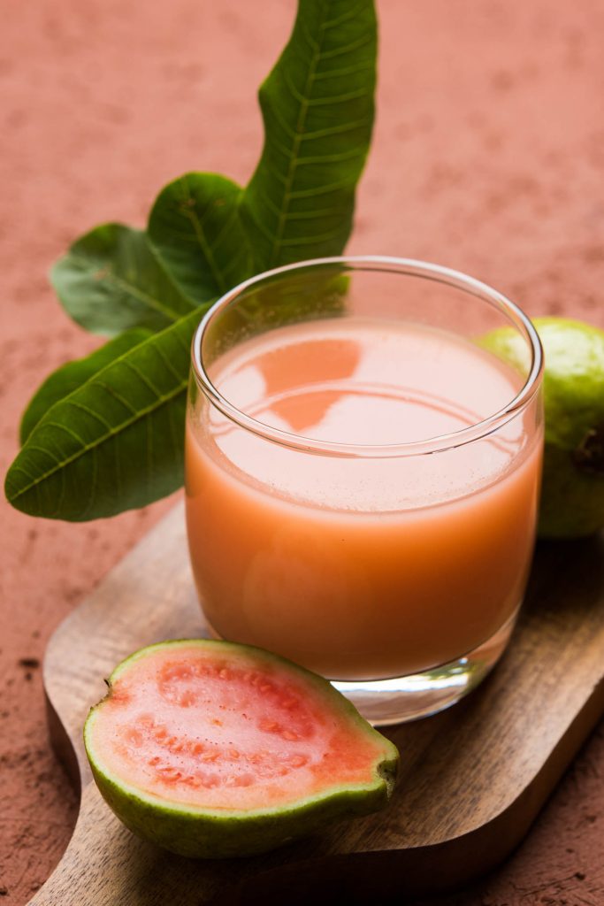 Guava juice or Amrud drink or Smoothie with fresh Guava fruit, moody lighting selective focus