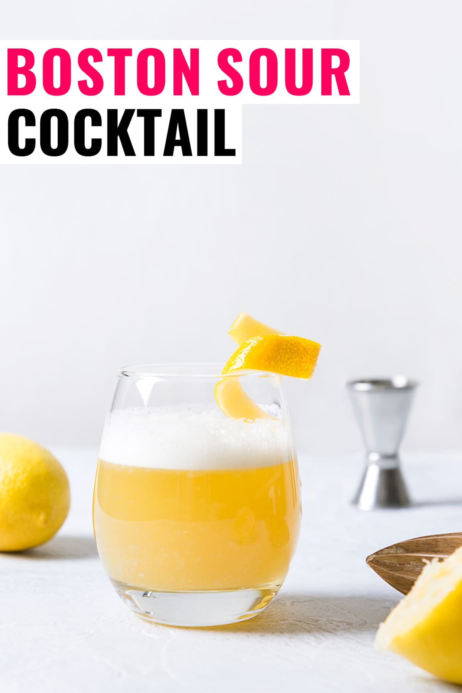 Boston sour cocktail - bourbon with lemon juice, sugar syrup and egg white in glass. Vertical orientation.