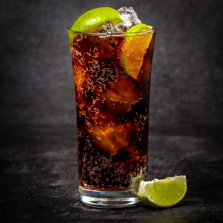 Charro negro cocktail with lime on a black background