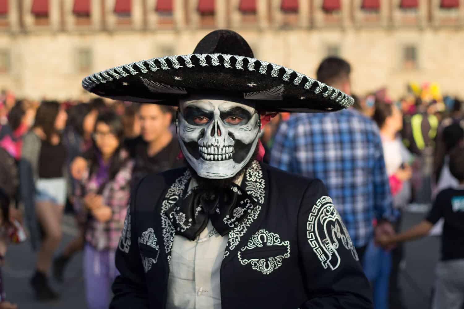 Man dressed up as Charro Negro character during day of the dead.