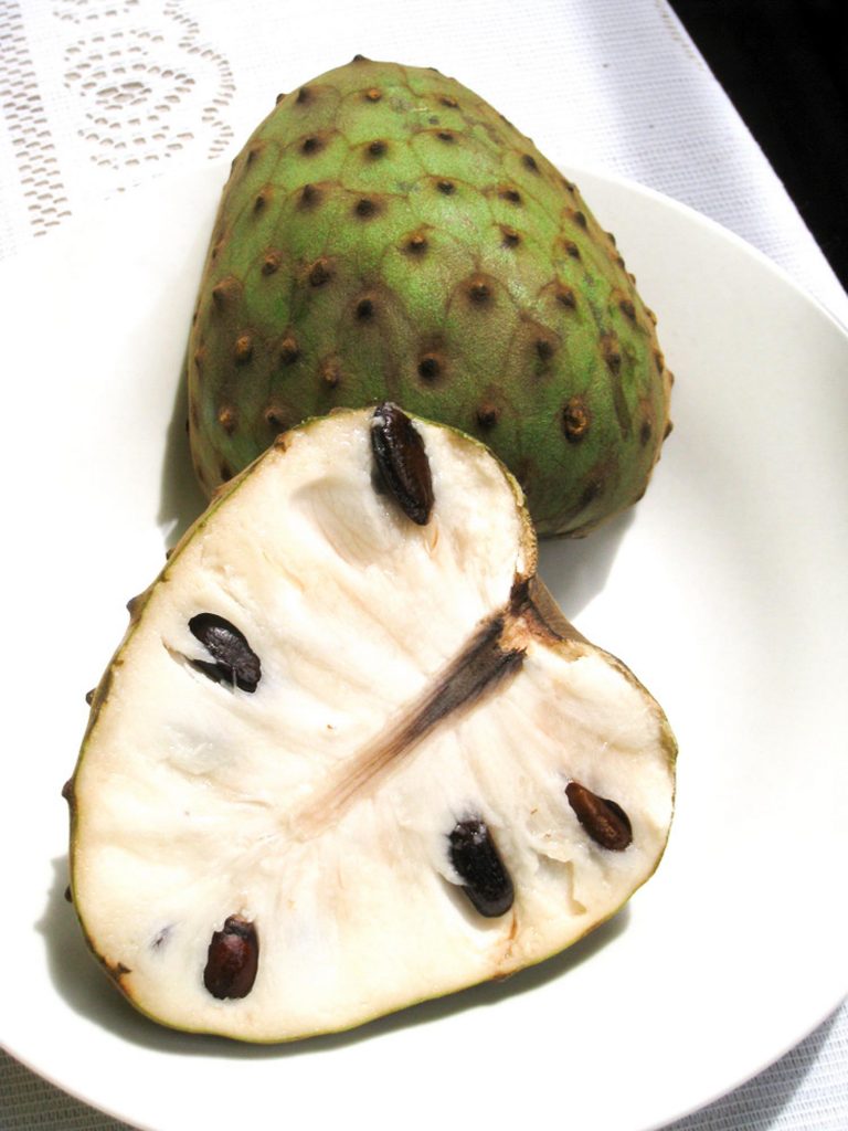 Cherimoya fruit in Hawaii on a white plate.
