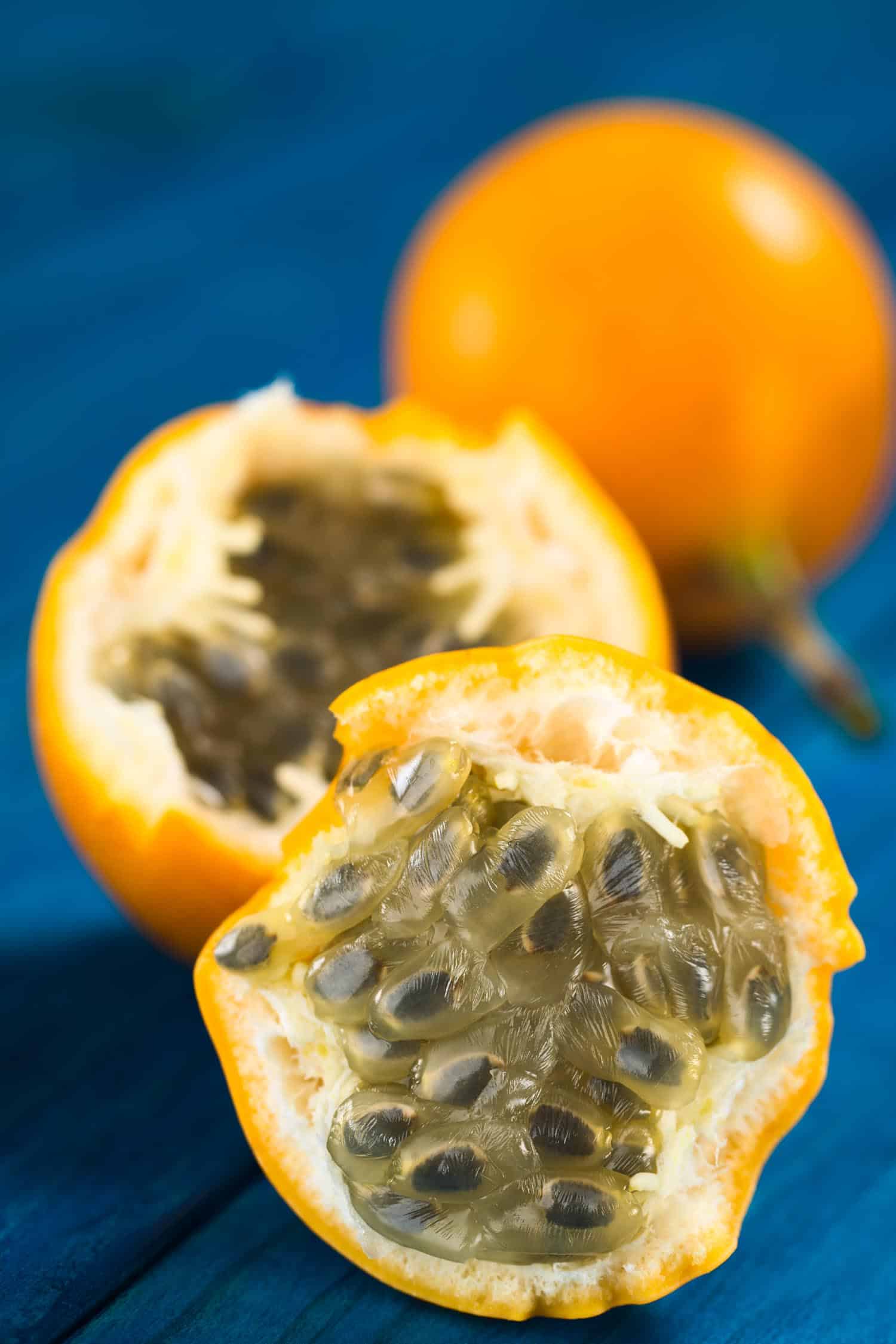 Fruit in Hawaii called lilikoi also known as sweet granadilla or grenadia (lat. Passiflora ligularis) fruit cut in half of which the seeds and the surrounding juicy pulp is eaten or is used to prepare juice 