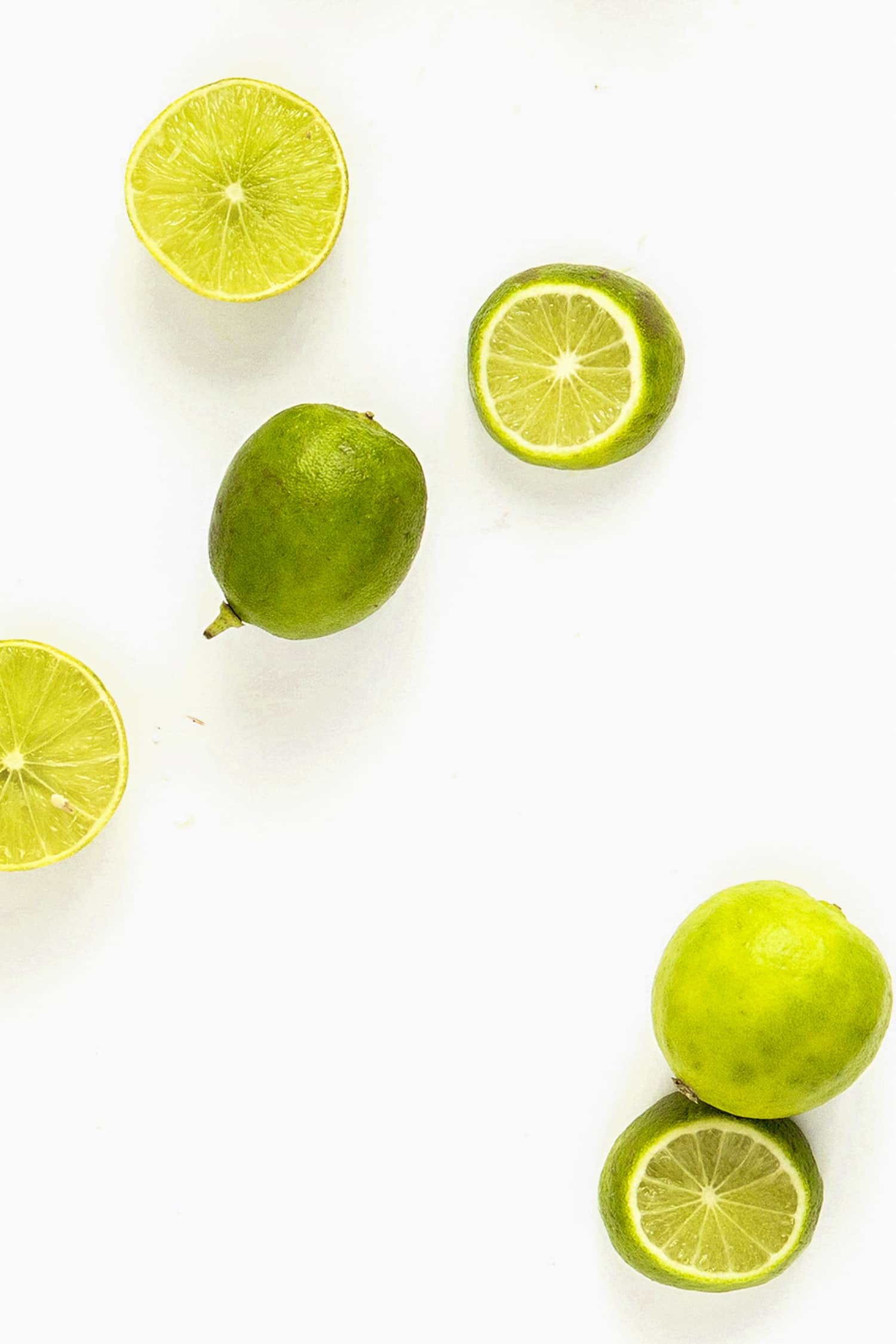 cut lime on a white background