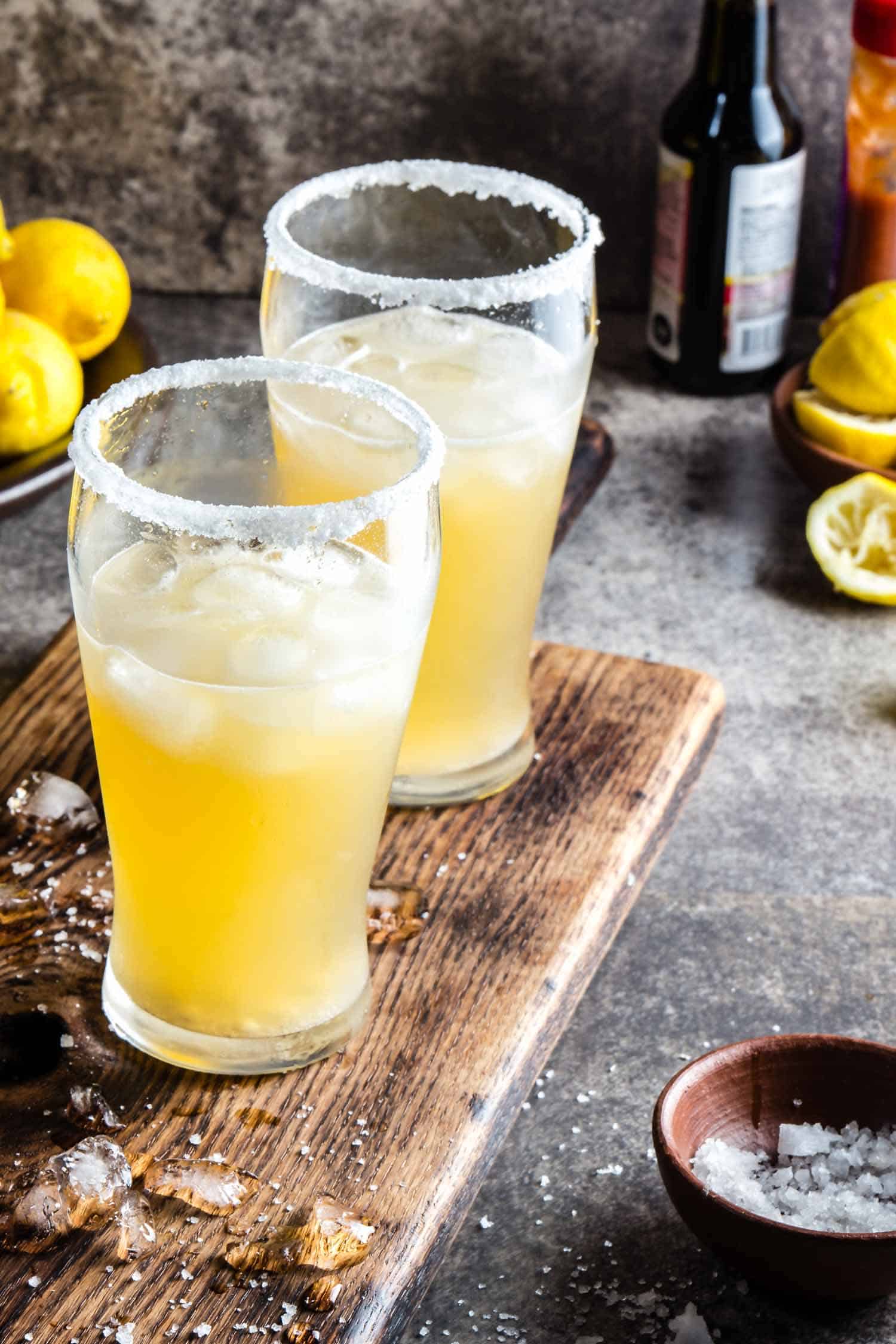 Two glasses of beer cocktail with salt rim