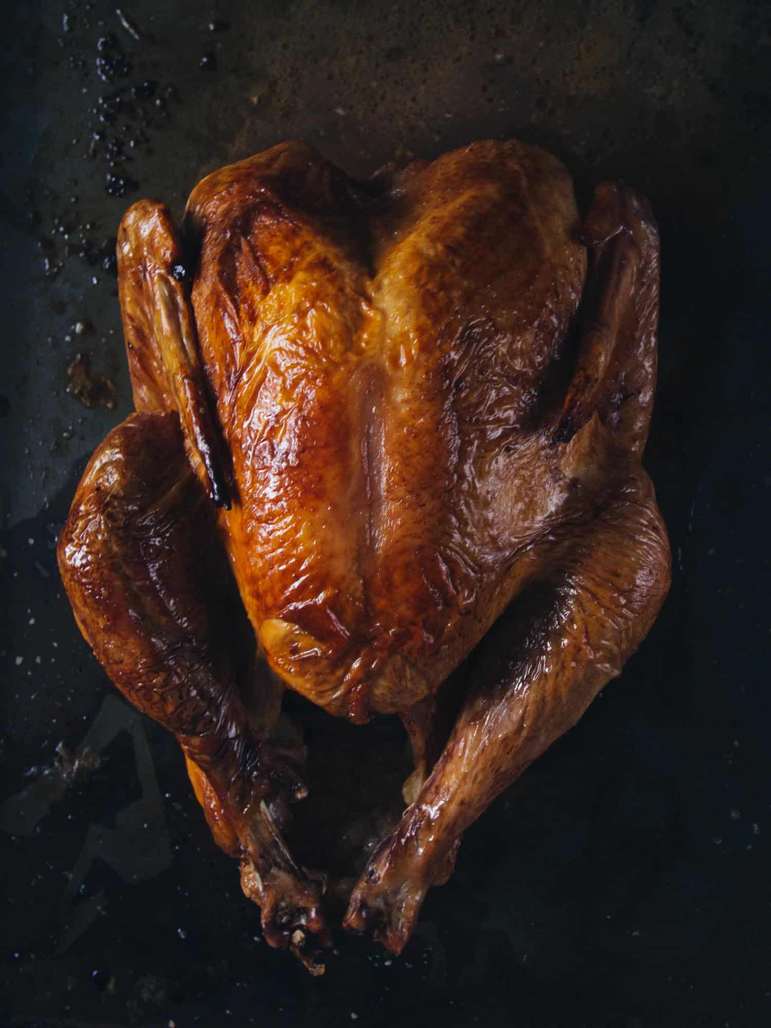 Roast chicken on a cooking sheet.