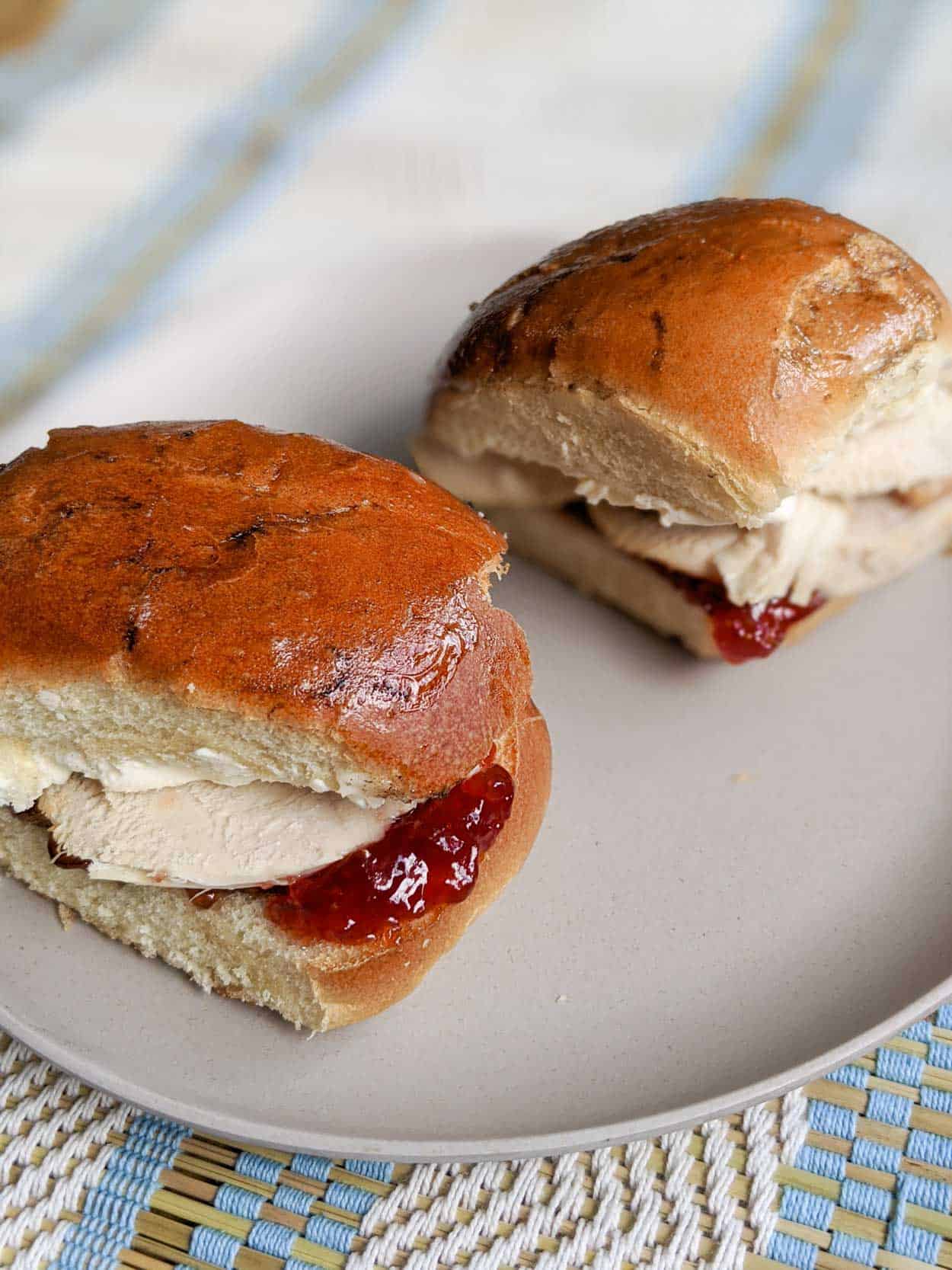 Cuban turkey sandwich with strawberry on one side and cream cheese on the other.