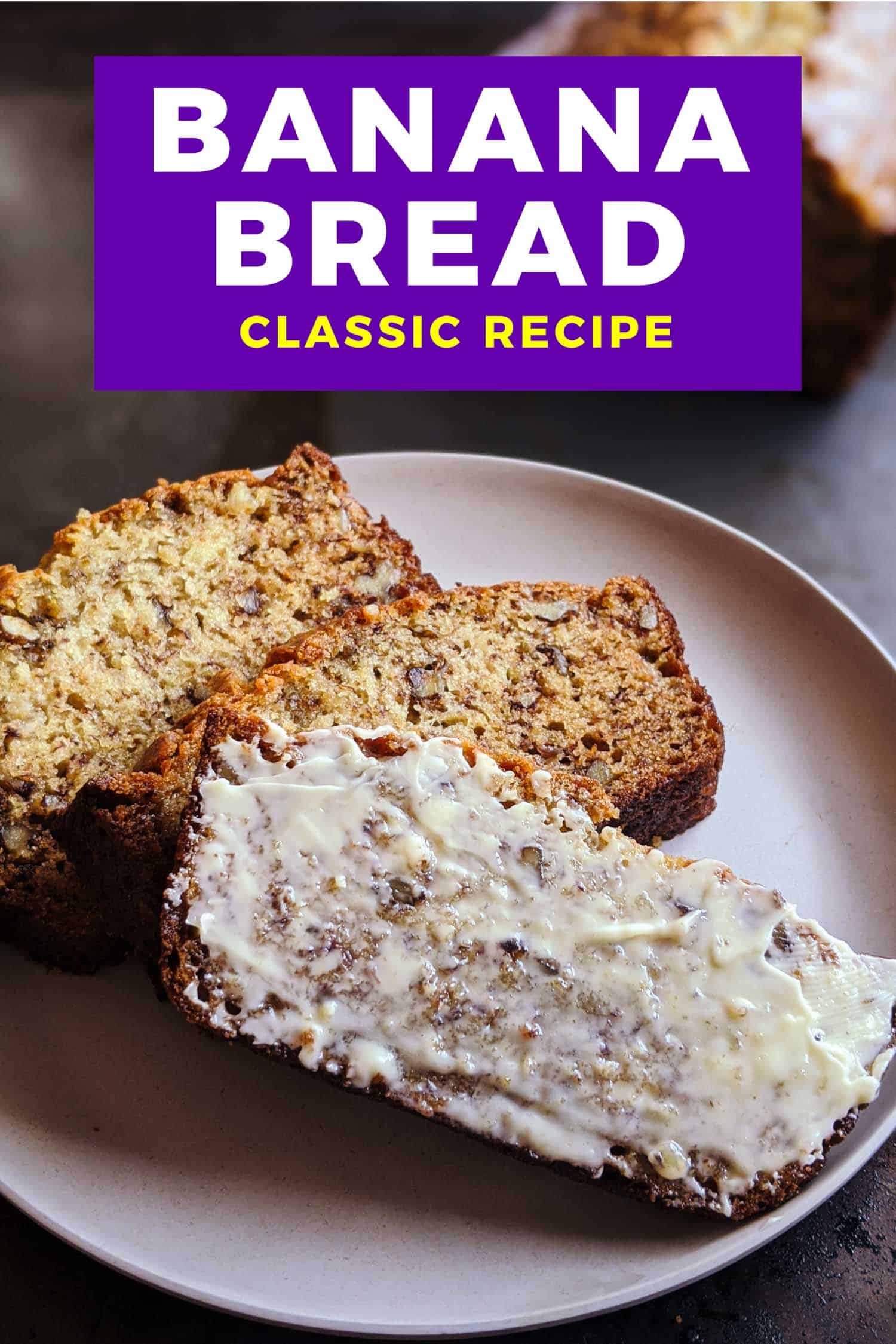 Old fashioned banana bread on a tray, one slice is buttered