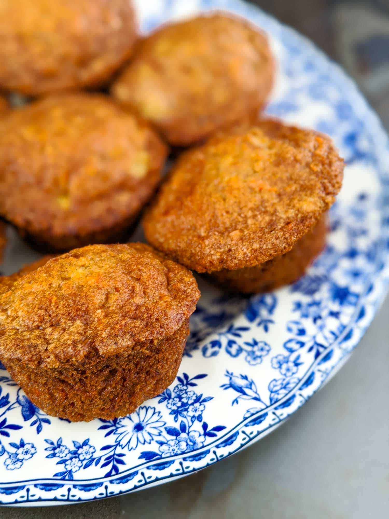 Pineapple carrot muffins on a plate.