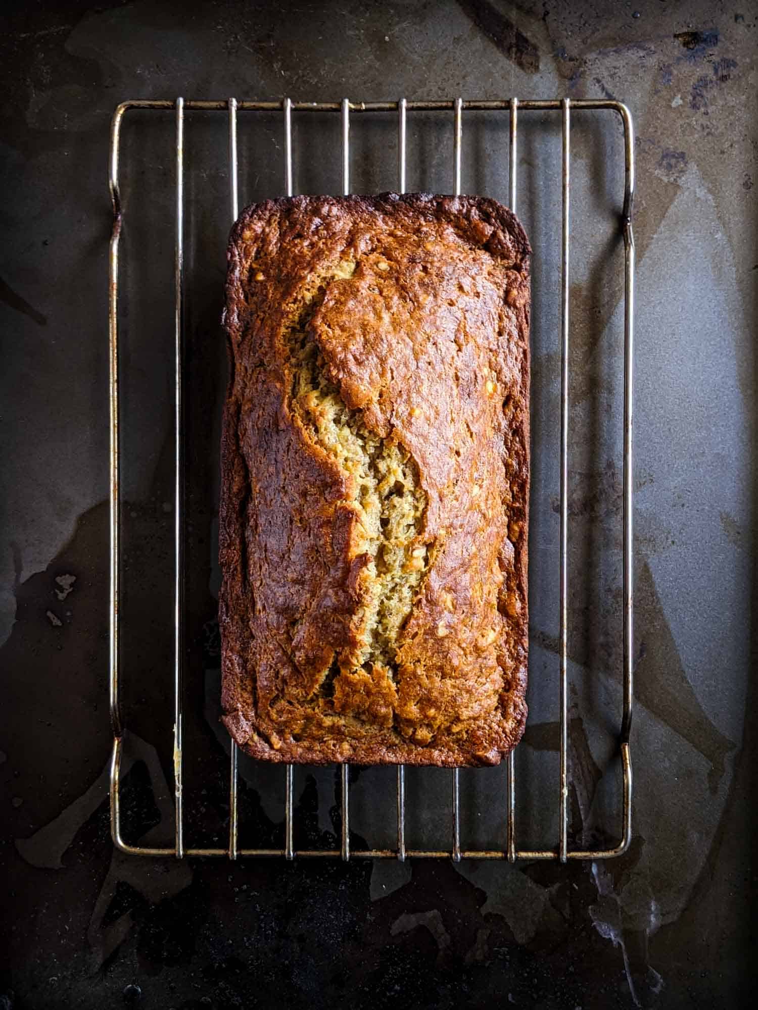 Classic banana bread recipe cooling on a wire rack