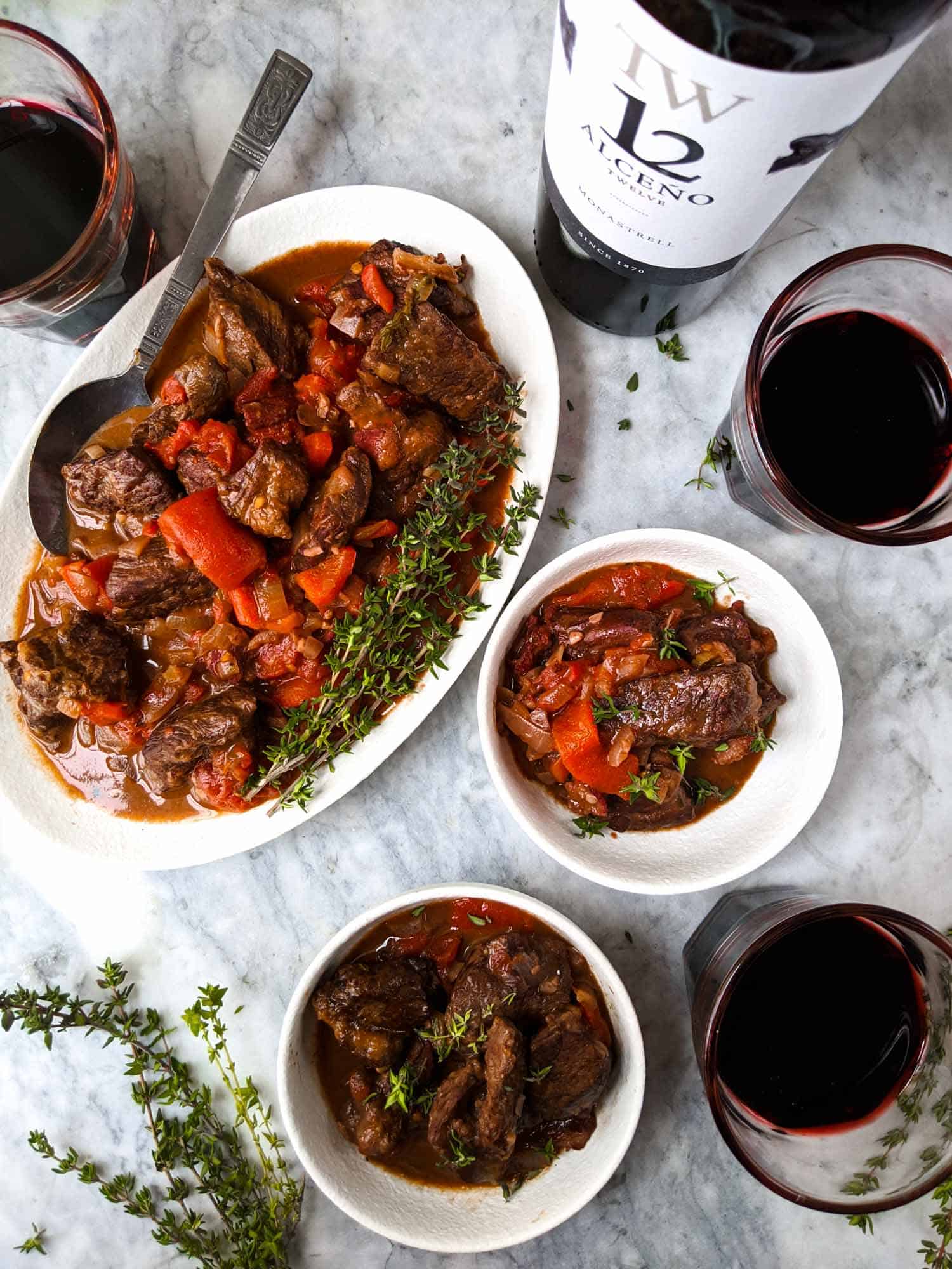 Beef stew on a white plate.