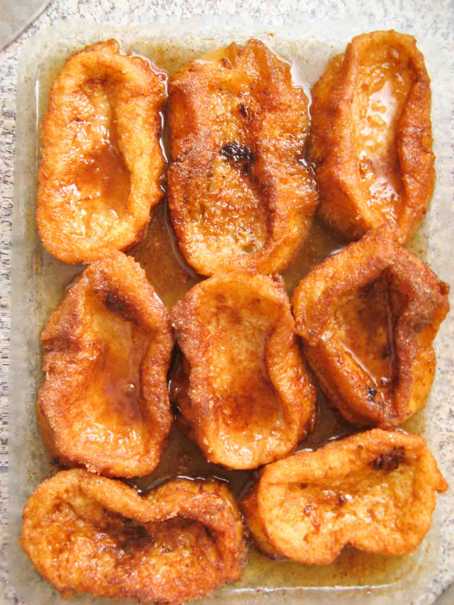 Torrejas, a Honduran dessert that are lady fingers coated in syrup, here eight on a plate