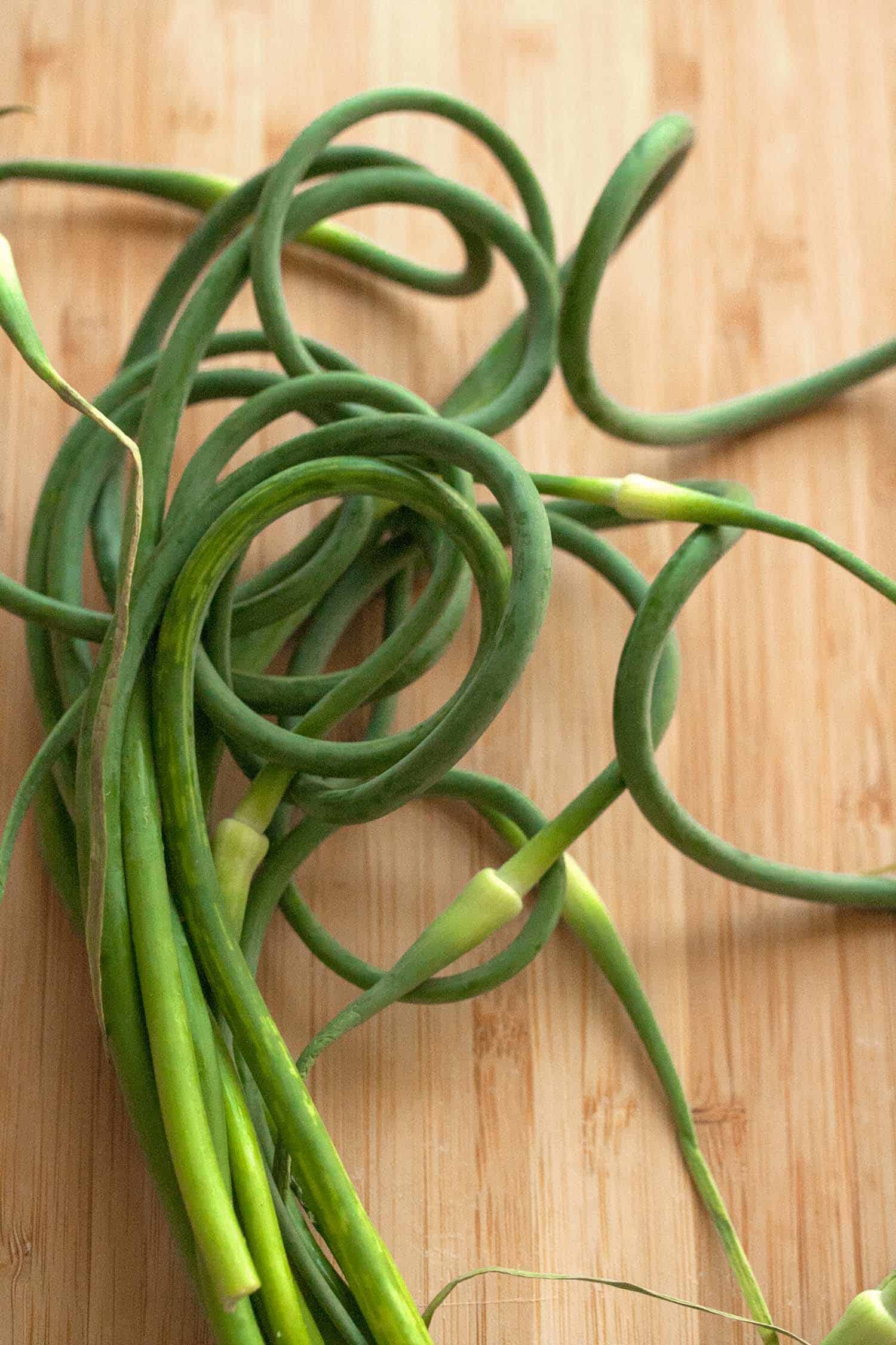 Bunch of garlic scapes on a table