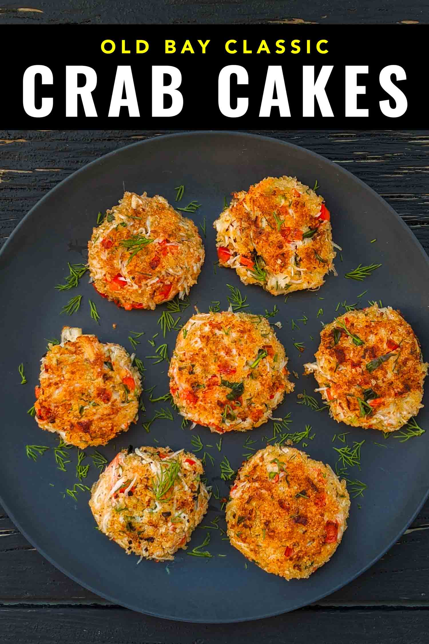 Seven snow crab cakes on a blue plate on a rustic background.