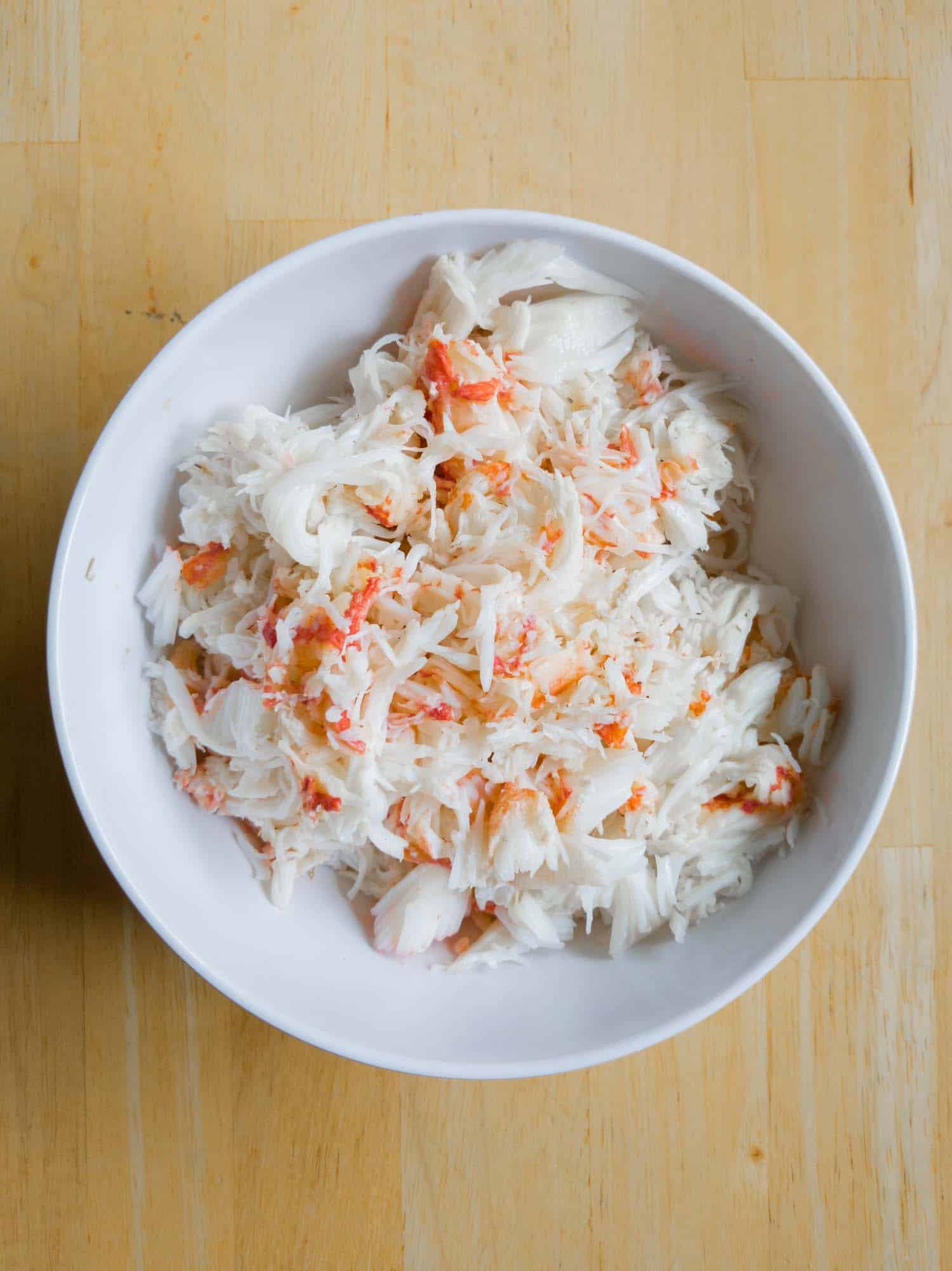 Snow crab in a white bowl on a table
