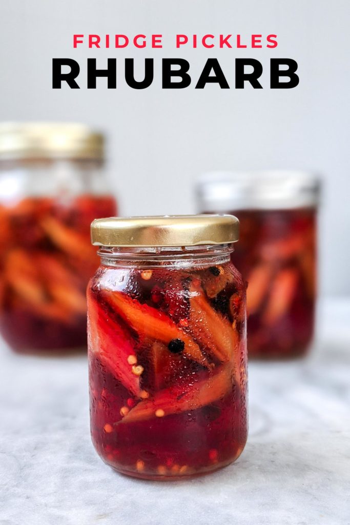 Three jars of rhubarb pickles, one in focus on white marble countertop with text that says fridge pickles rhubarb