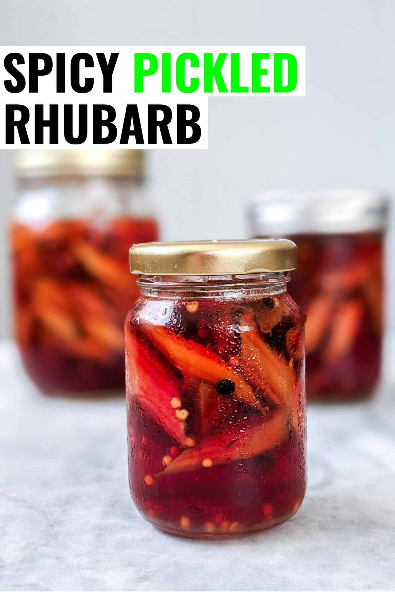 Three jars of pickled rhubarb on white with text that says spicy pickled rhubarb