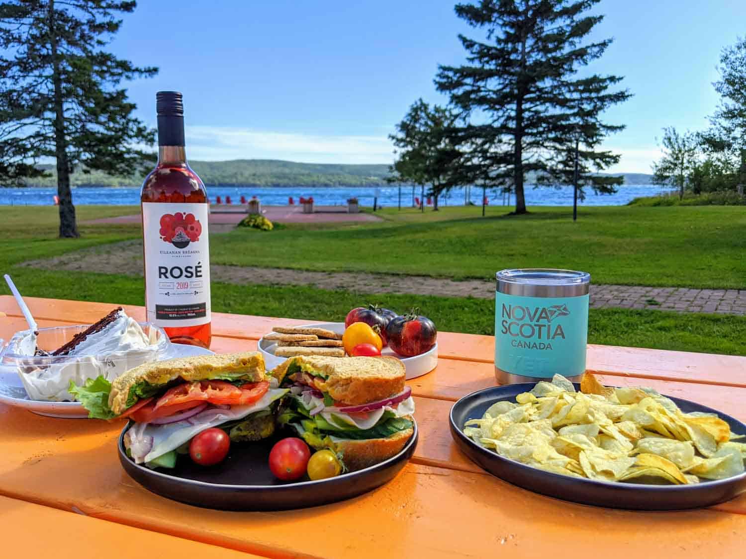 Lunch on an orange picnic table at Inverary resort in Baddeck Nova Scotia