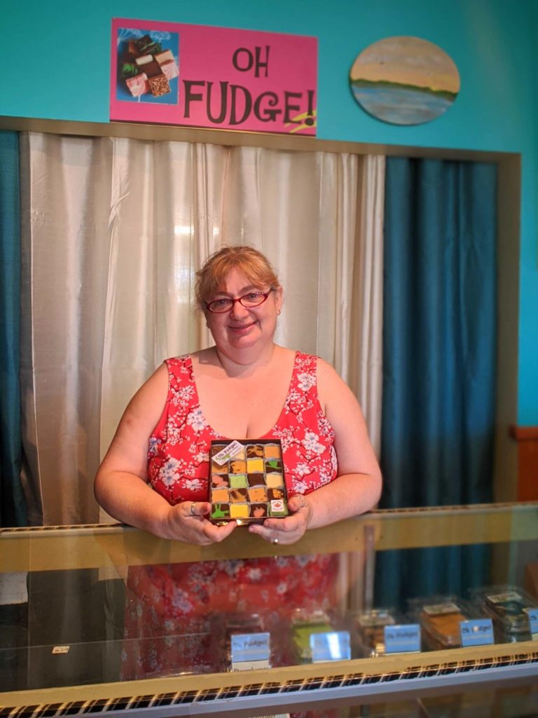 Patricia holding potato fudge in Souris