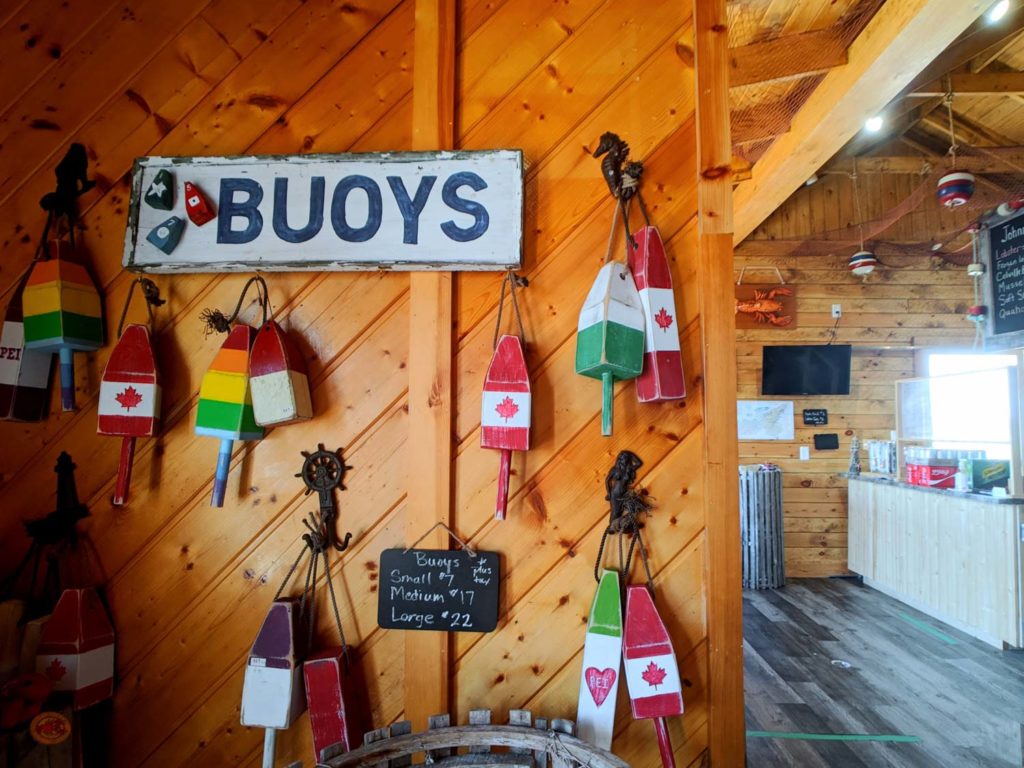 Lobster Shack Souris PEI interior with a bunch of buoys on a wall