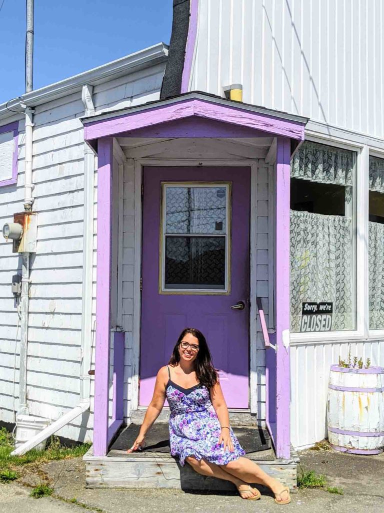 Ayngelina sitting outside Edna's Bakery in Port Maitland Nova SCotia