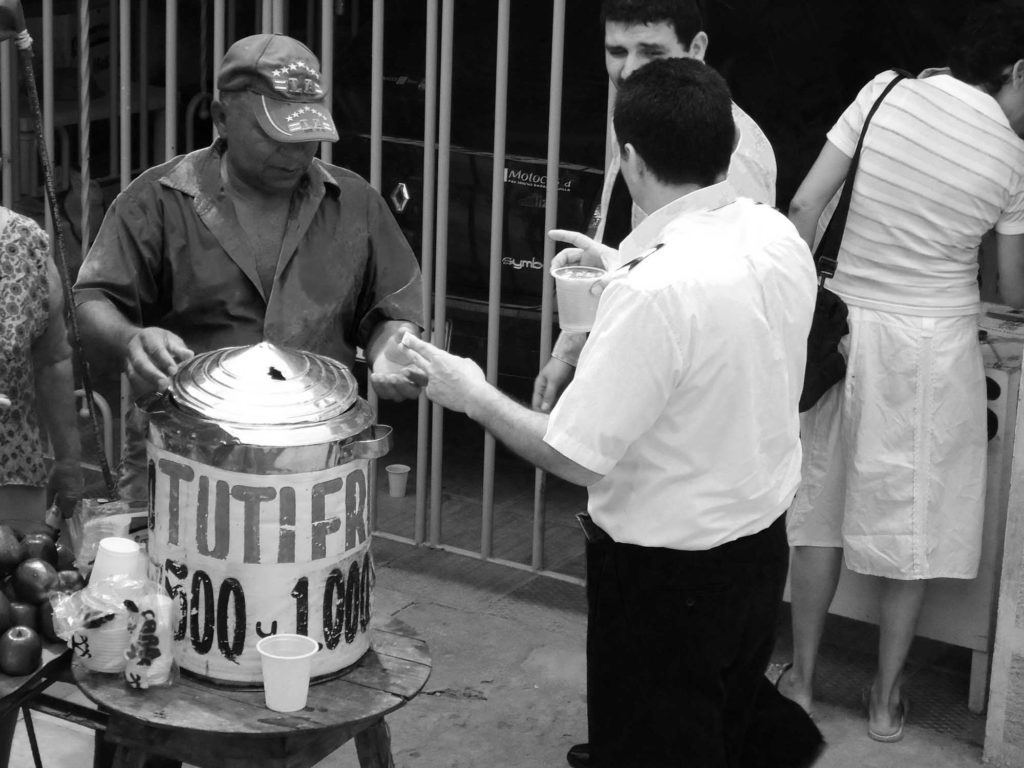 Man serving Tutifruiti drink on street in Colombia South America