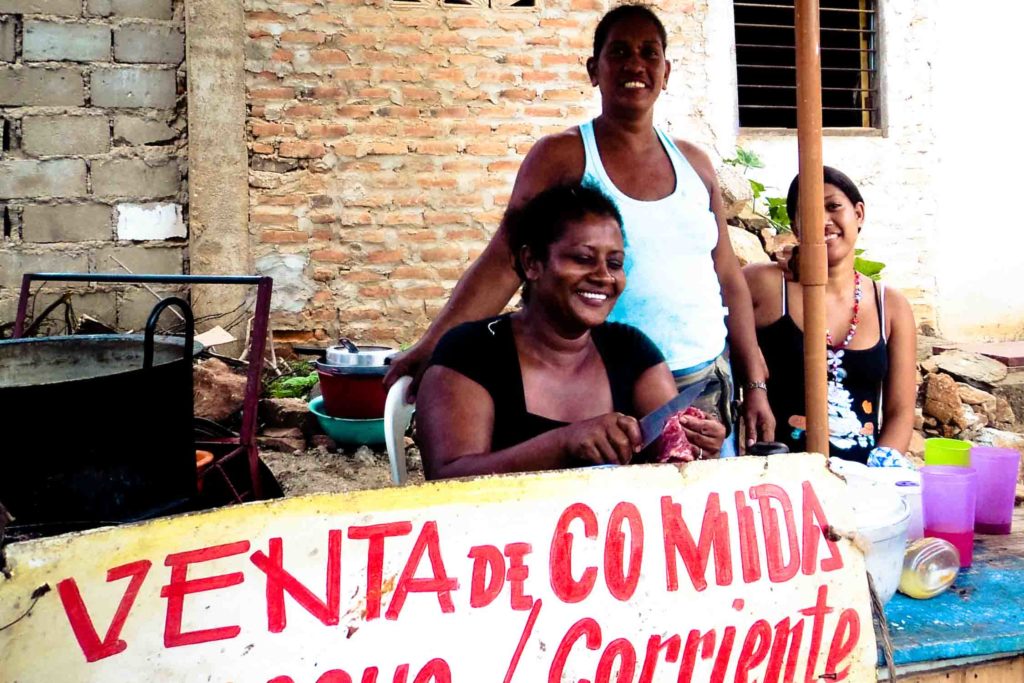 Women selling food at restaurant in Taganga