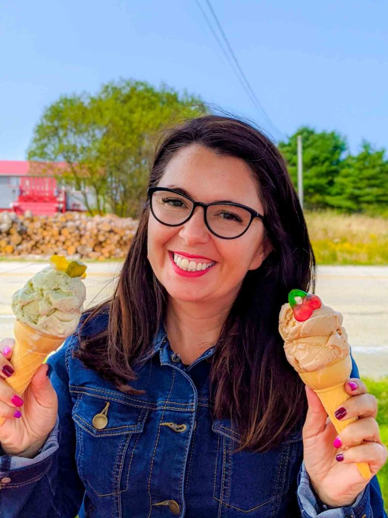 Ayngelina holding two ice cream cones at Hakuna Matata in Yarmouth Nova Scotia