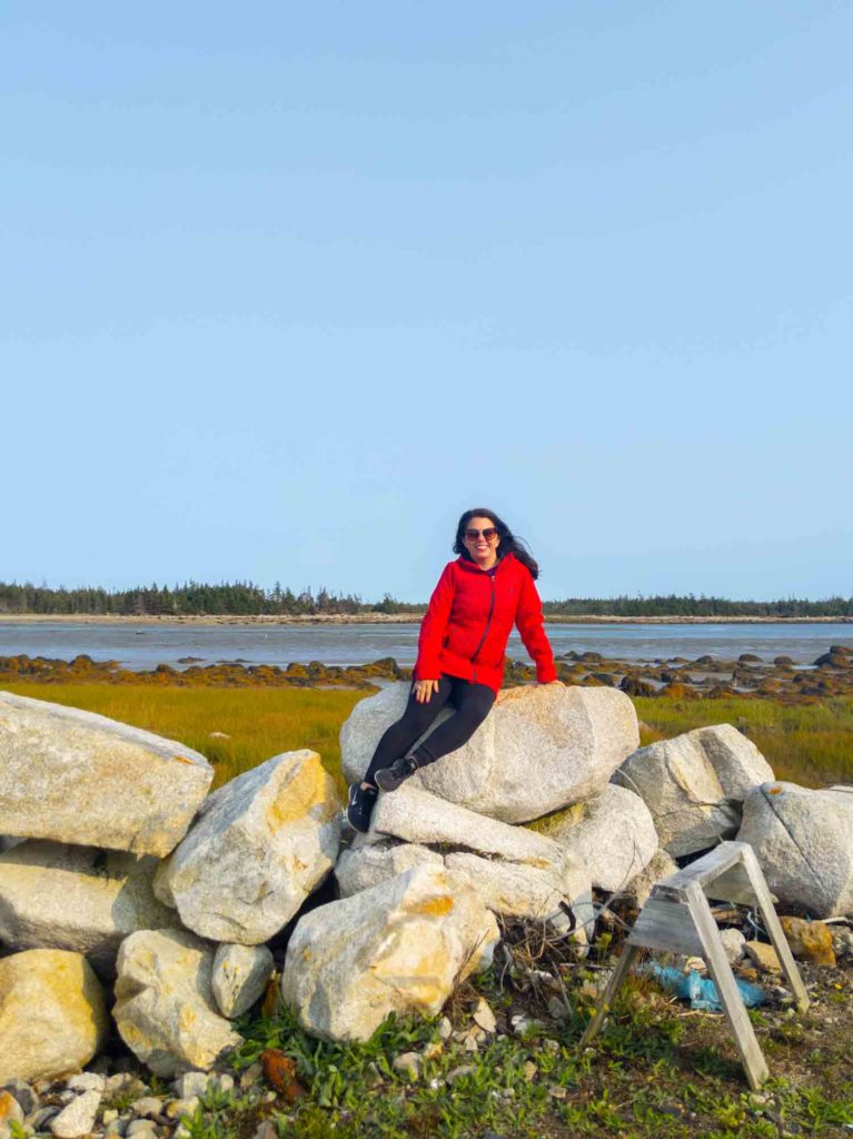 Ayngelina sitting on rocks on one of Tusket Islands in Yarmouth NS