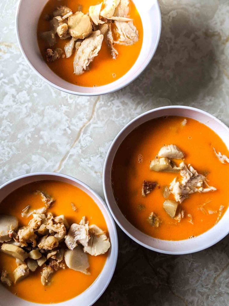 Bowls of seafood chowder on a counter top.