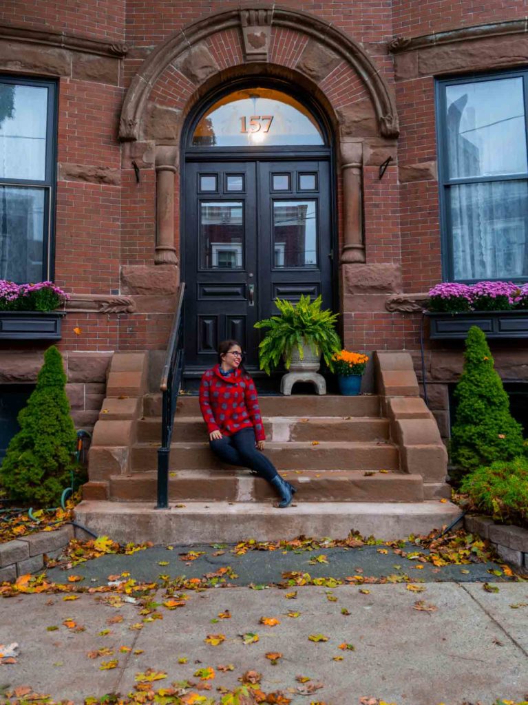 Ayngelina sitting on house stoop in Saint John New Brunswick