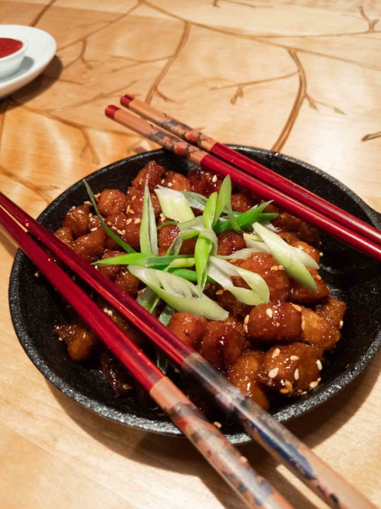 Korean tofu sticky bites in a bowl with chopsticks