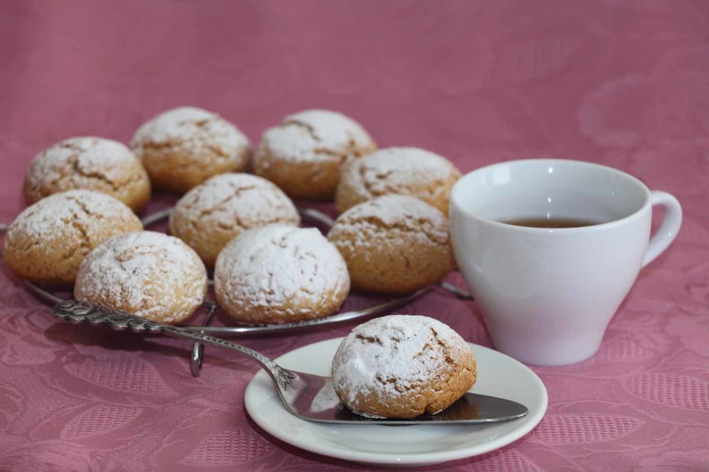Polvorosas shortbread cookies in Guatemala on a plate with tea on a pink tablecloth