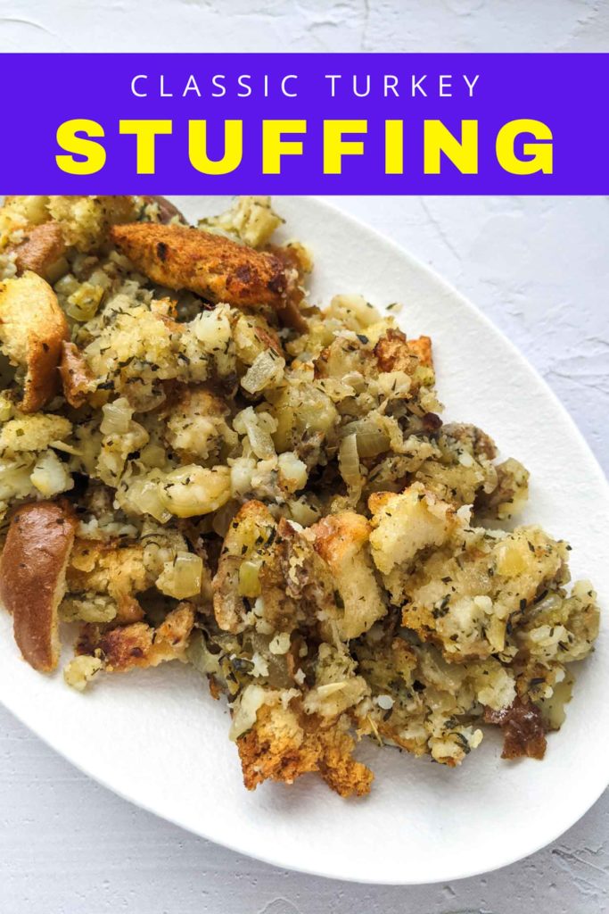 Traditional turkey dressing with potato and bread on a white plate and white background