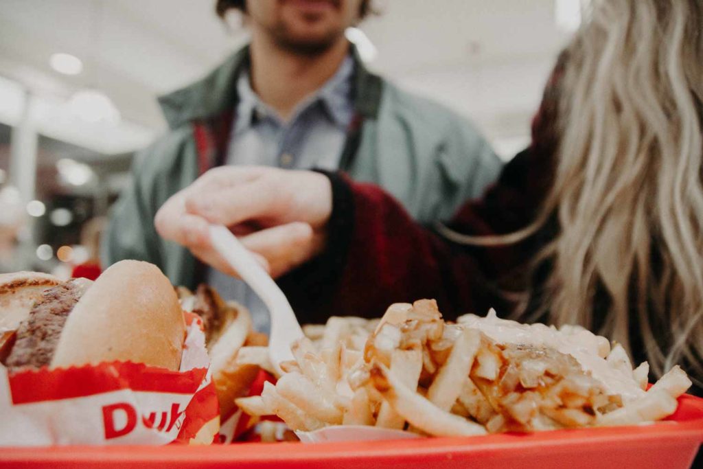 People eating In N Out Burger in the restaurant