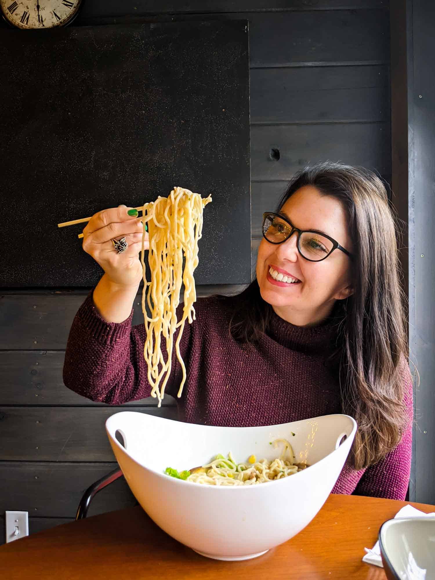 Woman eating ramen in Yarmouth NS